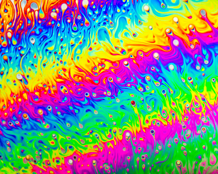 Unmitigated glee shown in a colorful, vivid, abstract soap film photograph