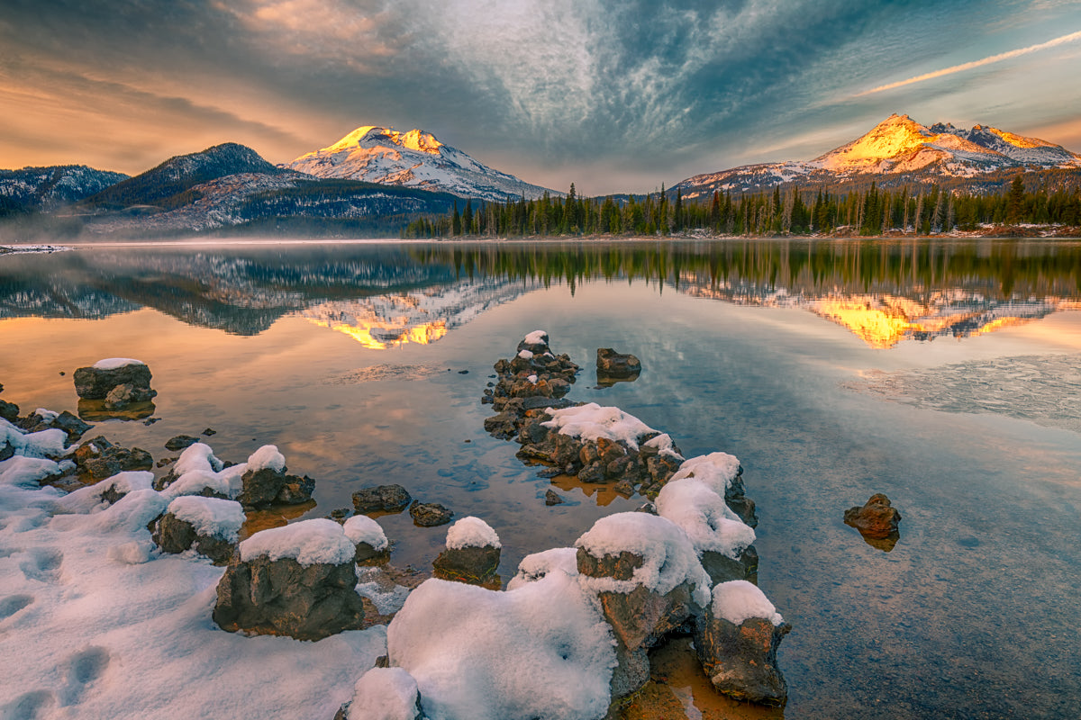 Incredible image of a sunset at Sparks Lake near Bend Oregon with South Sister and Broken Top peaks in the background